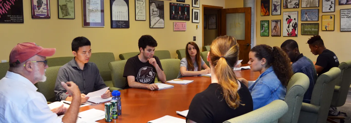 Carter Lewis, Playwright in Residence leads his playwriting class in discussion of their own works.