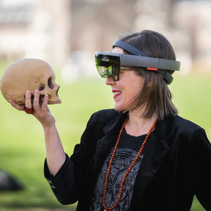 Elizabeth Hunter strikes a Hamlet pose with a prop skull. 
