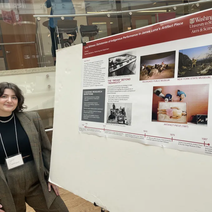 Image of Sophie standing in front of their research poster